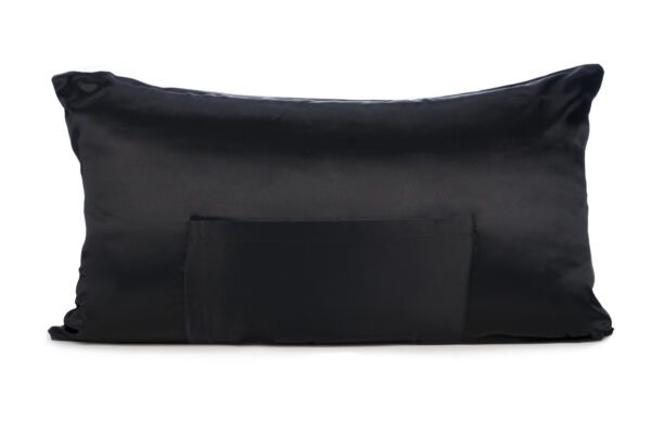 A black pillow with a bow on it
